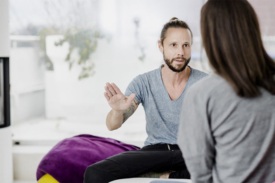 Occupational therapist speaking to client